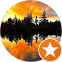 Lake and pine forest at sunset